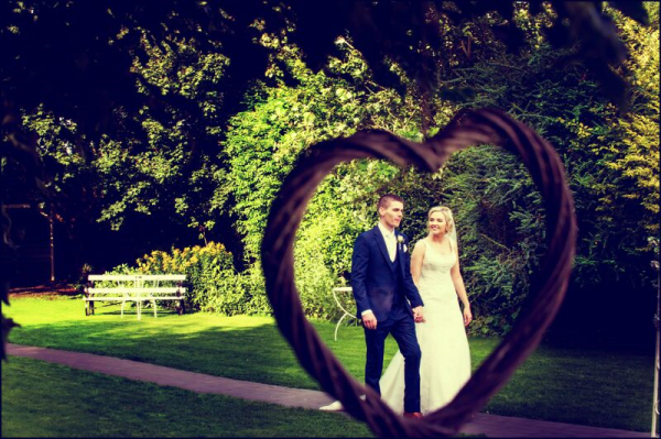 Couple in Garden through heart